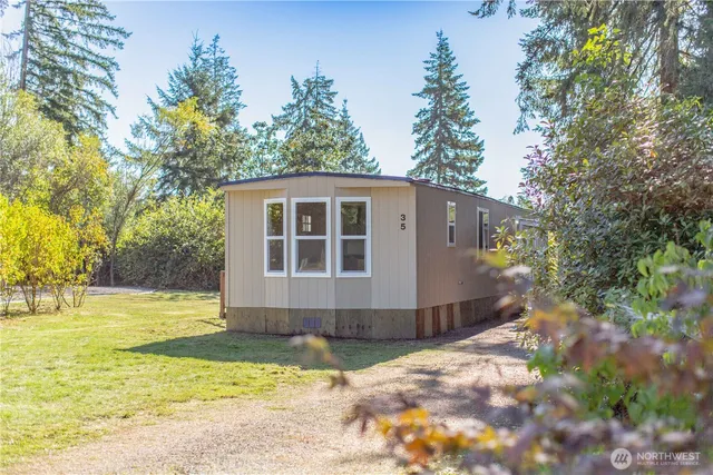 a house with trees in the background