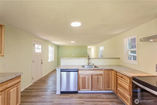 a kitchen with a sink and cabinets