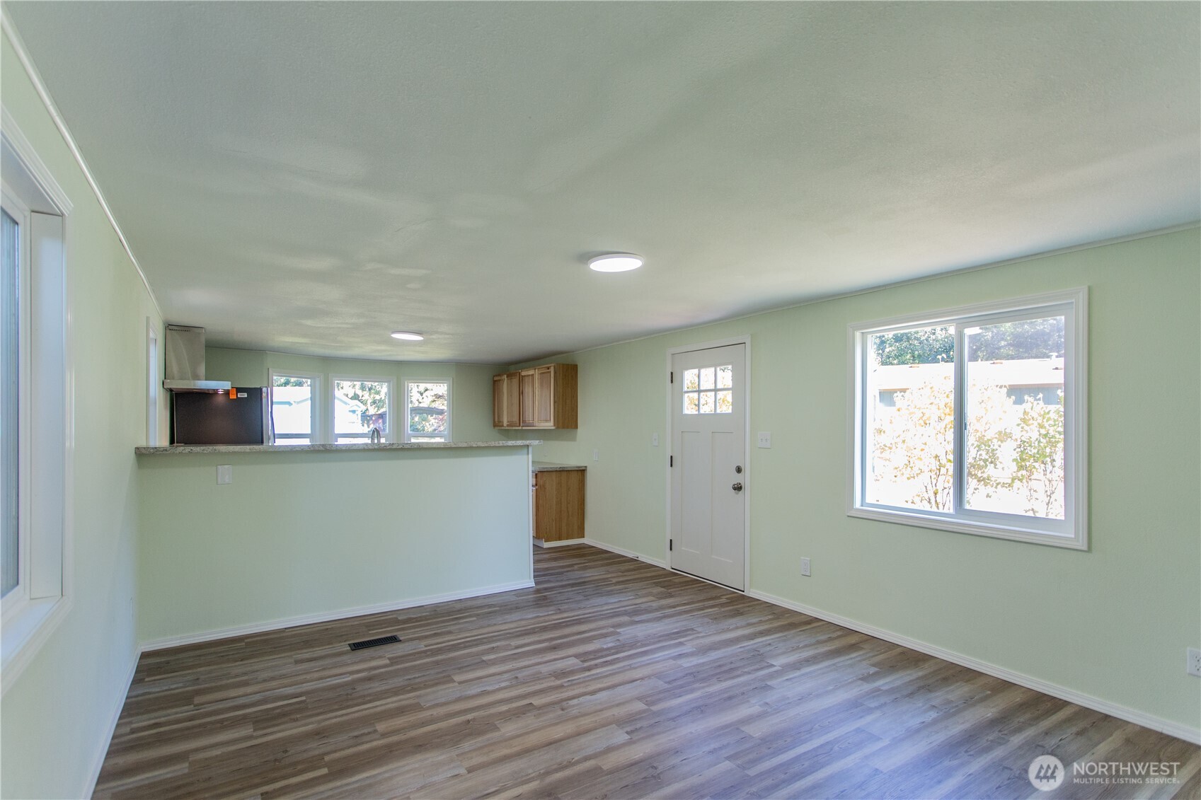 17340 Sargent Road Southwest, Unit 35 Rochester, WA 98579 - Photo 9 of 25 a view of empty room with wooden floor and fan