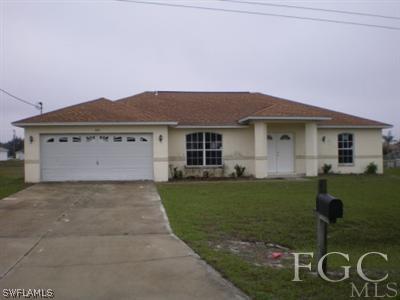 808 Rue Labeau Circle Fort Myers, FL 33913 - Photo 1 of 9 a front view of a house with garden