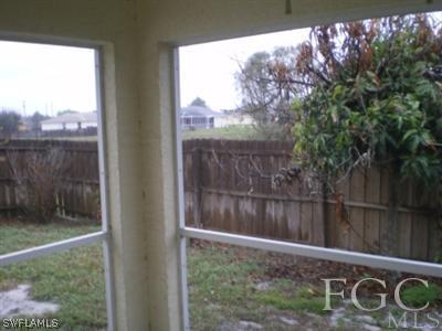 808 Rue Labeau Circle Fort Myers, FL 33913 - Photo 8 of 9 a view of a wooden fence with a yard