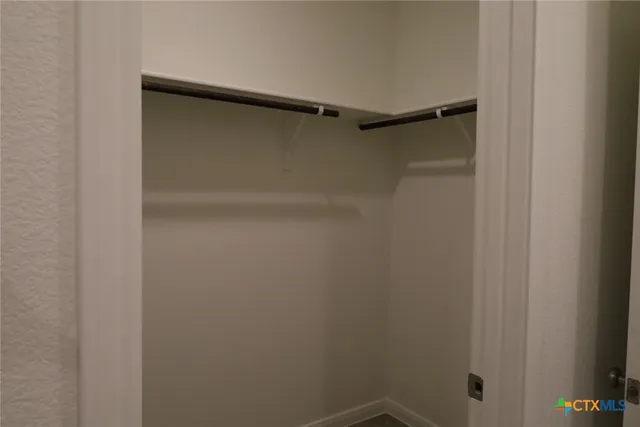 an empty room with a hallway