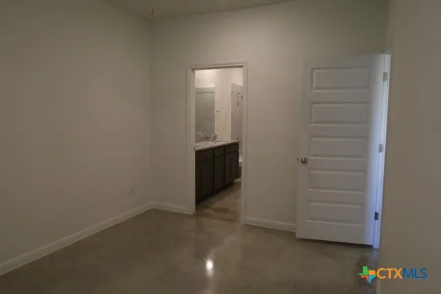 a kitchen with a sink and a stove top oven