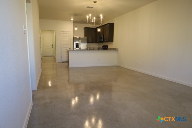 2916 Wildcat Rdg Road, Unit B Temple, TX 76501 - Photo 20 of 39 a view of a kitchen with a sink and a chandelier