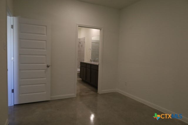 2916 Wildcat Rdg Road, Unit B Temple, TX 76501 - Photo 38 of 39 a view of an empty room and hallway with wooden floor