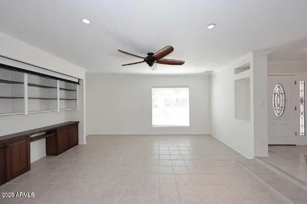 a view of workspace with cabinet and window
