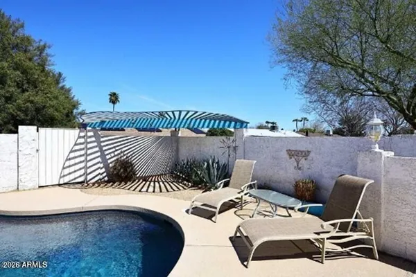 a view of a kitchen with kitchen island a sink a stove and wooden floor