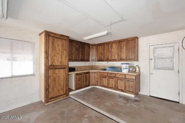 a view of a bathroom with a sink and a granite counter top