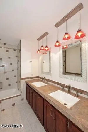 a view of a storage and utility room with closet dryer