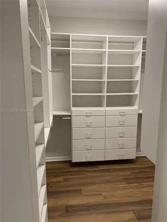 a bathroom with a bathtub toilet and a shower