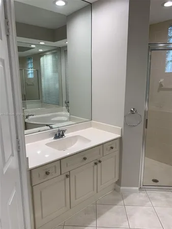 a view of a room with wooden floor and windows