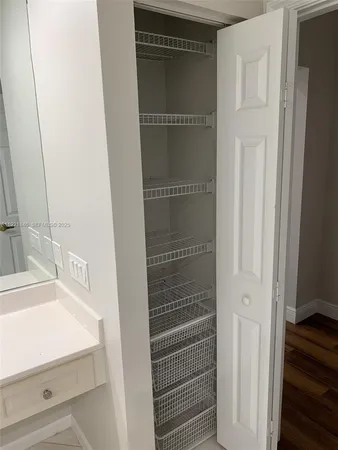 a view of room with wooden floor