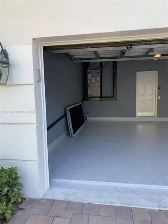 a vase of flowers sitting on a table with a garden
