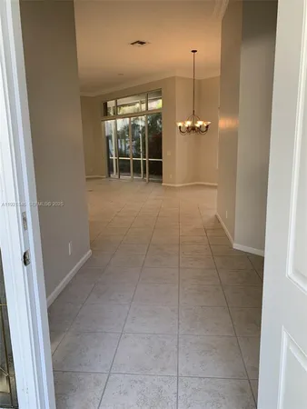 an empty room with furniture and a window