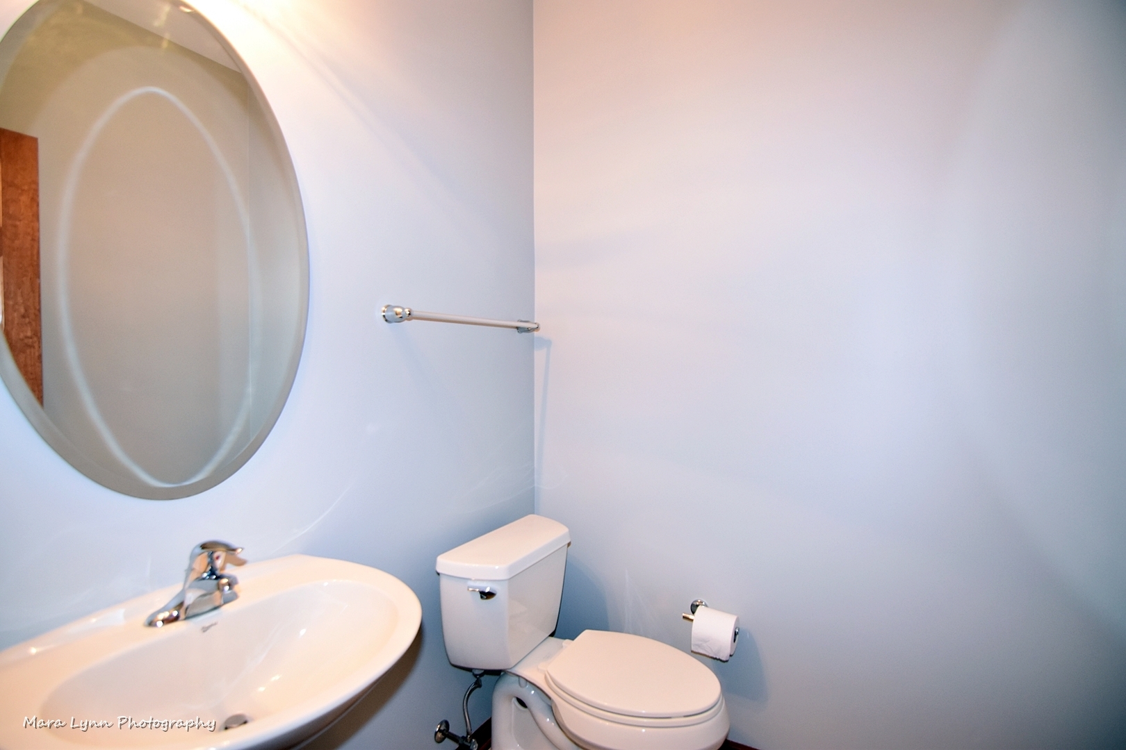 427 Acushnet Street Elgin, IL 60124 - Photo 12 of 26 a bathroom with a sink mirror and toilet