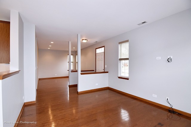 427 Acushnet Street Elgin, IL 60124 - Photo 5 of 26 a view of an empty room with a window
