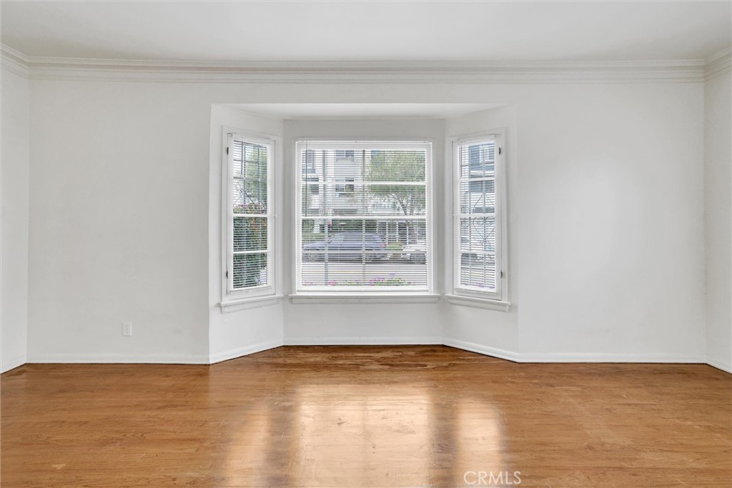 515 Rose Avenue Venice, CA 90291 - Photo 16 of 49 a view of empty room with wooden floor and fan