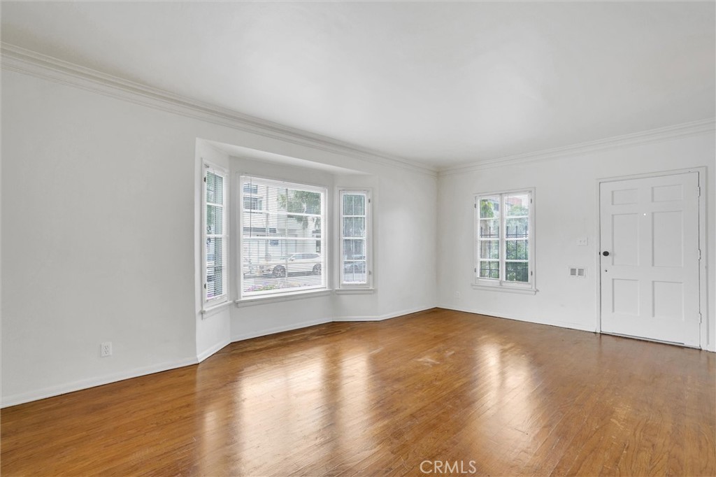 515 Rose Avenue Venice, CA 90291 - Photo 17 of 49 a view of empty room with wooden floor and fan
