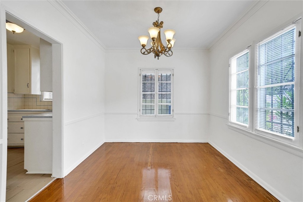 515 Rose Avenue Venice, CA 90291 - Photo 19 of 49 a view of empty room with wooden floor and fan