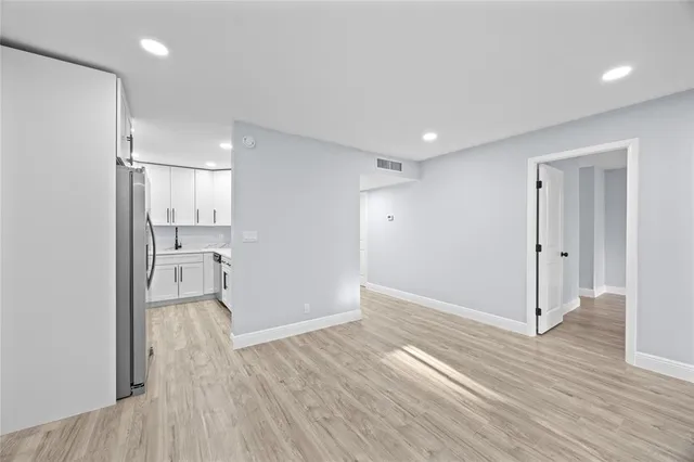 a view of a kitchen from the hallway