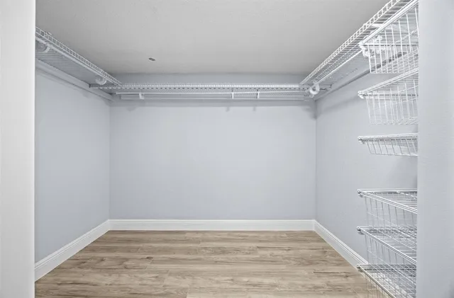 a view of an empty walk in closet