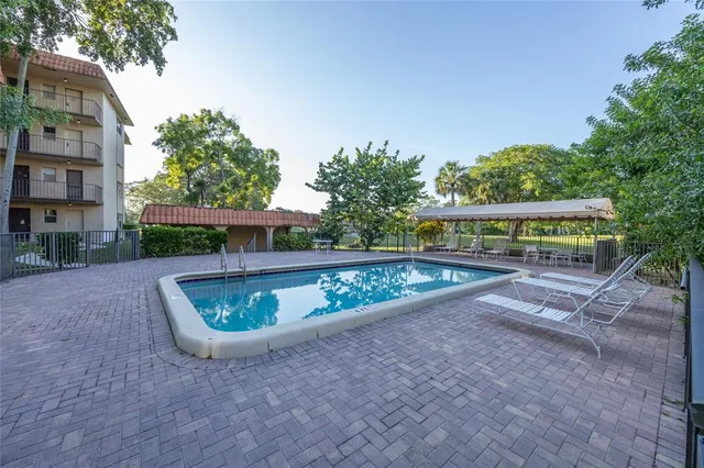 a view of swimming pool with seating