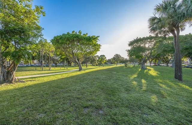 a view of a swimming pool with a yard