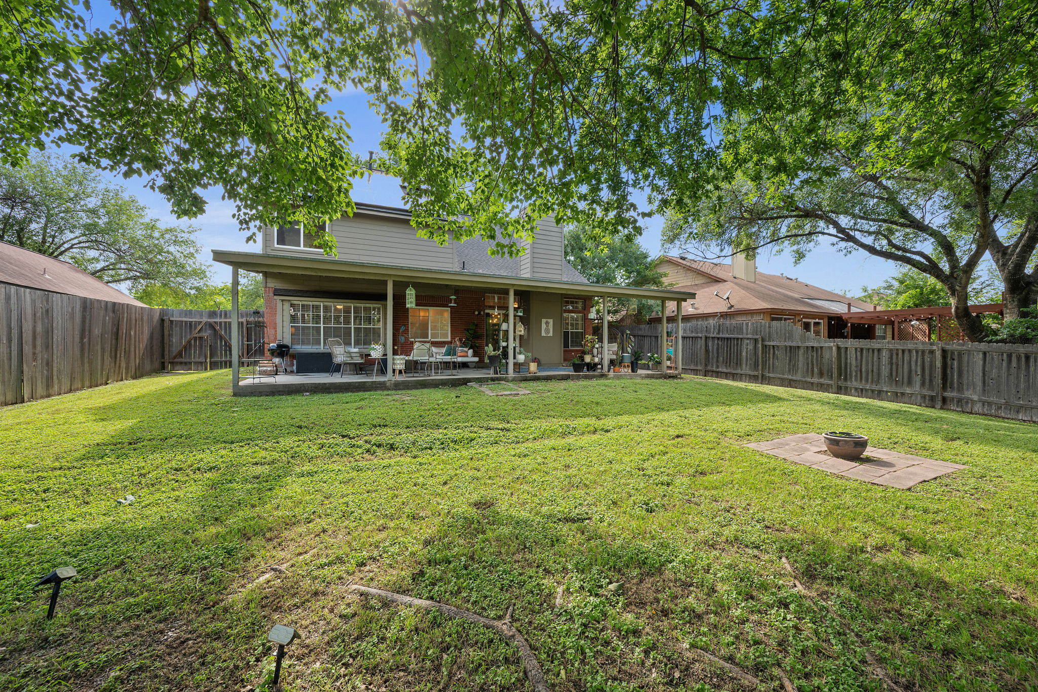 705 Canyon Bend Road Pflugerville, TX 78660 - Photo 23 of 23 a view of a house with a yard porch and sitting area
