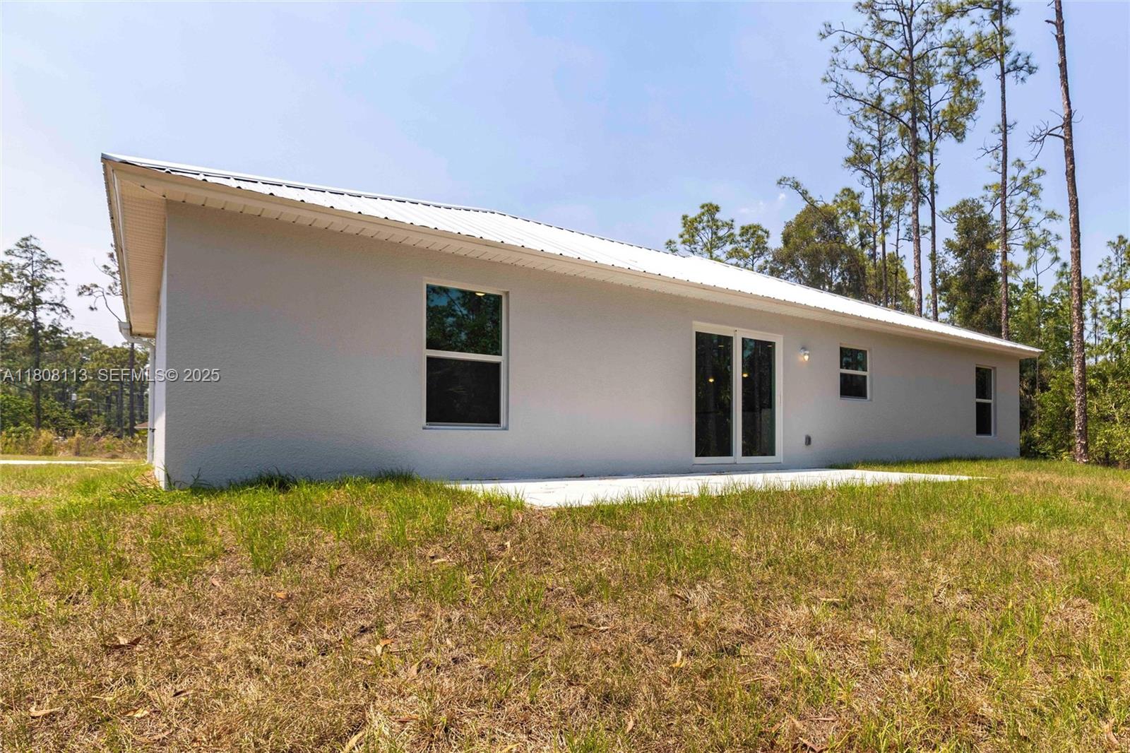 2006 Rosa Court, Unit 2006 Lehigh Acres, FL 33972 - Photo 20 of 22 a view of a house with yard