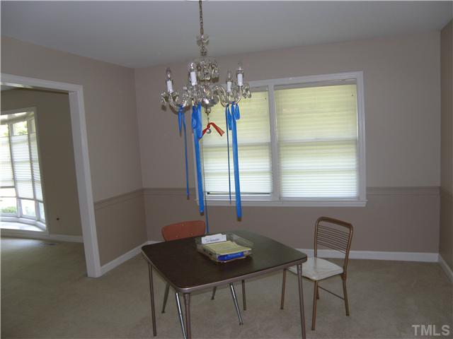 5219 Melbourne Road Raleigh, NC 27606 - Photo 8 of 21 Streamers hang from this chandelier so the floor watchers won't bang their heads