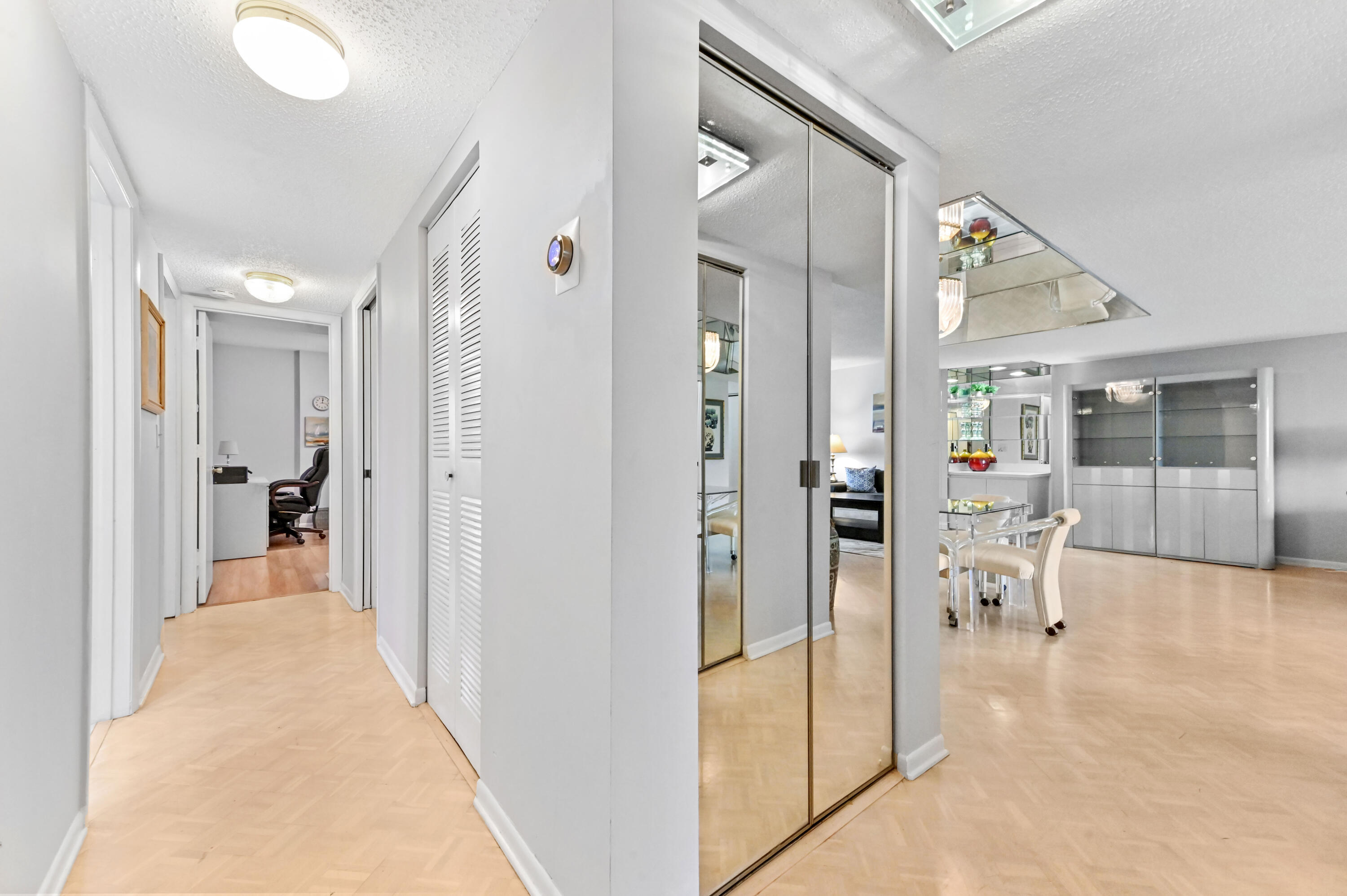 6768 10th Avenue North, Unit 316 Lake Worth, FL 33467 - Photo 15 of 38 a view of a hallway with dining room and a livingroom view