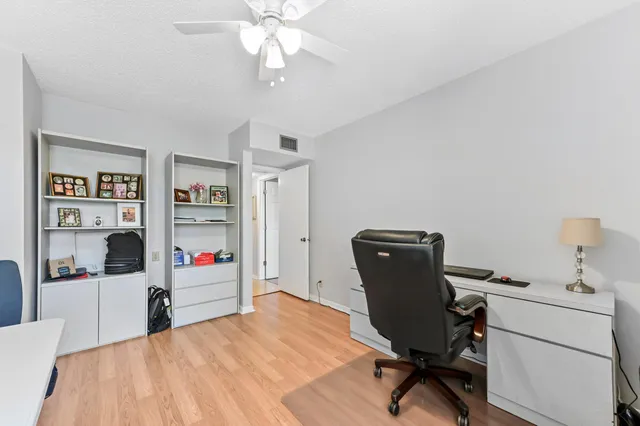 a workspace with furniture and window