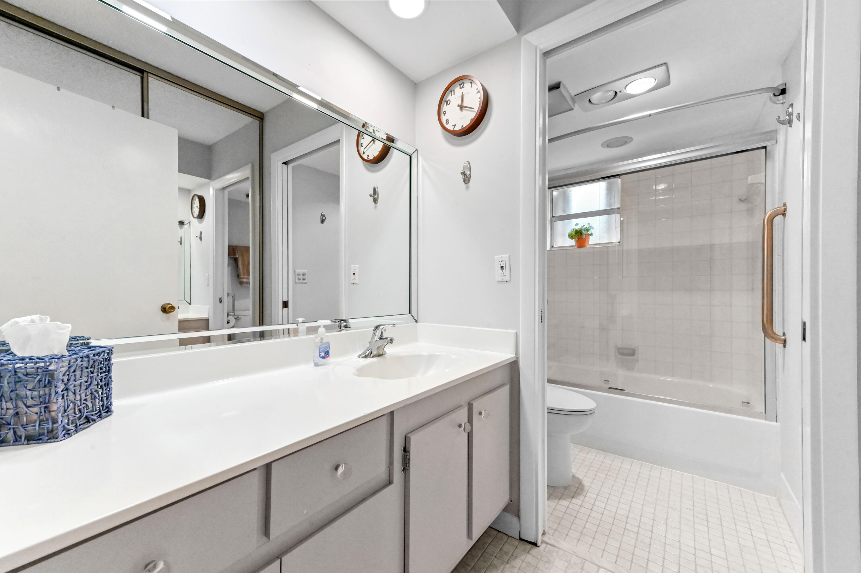 6768 10th Avenue North, Unit 316 Lake Worth, FL 33467 - Photo 21 of 38 a bathroom with a sink a toilet and shower