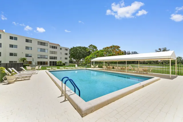 a view of swimming pool with outdoor seating