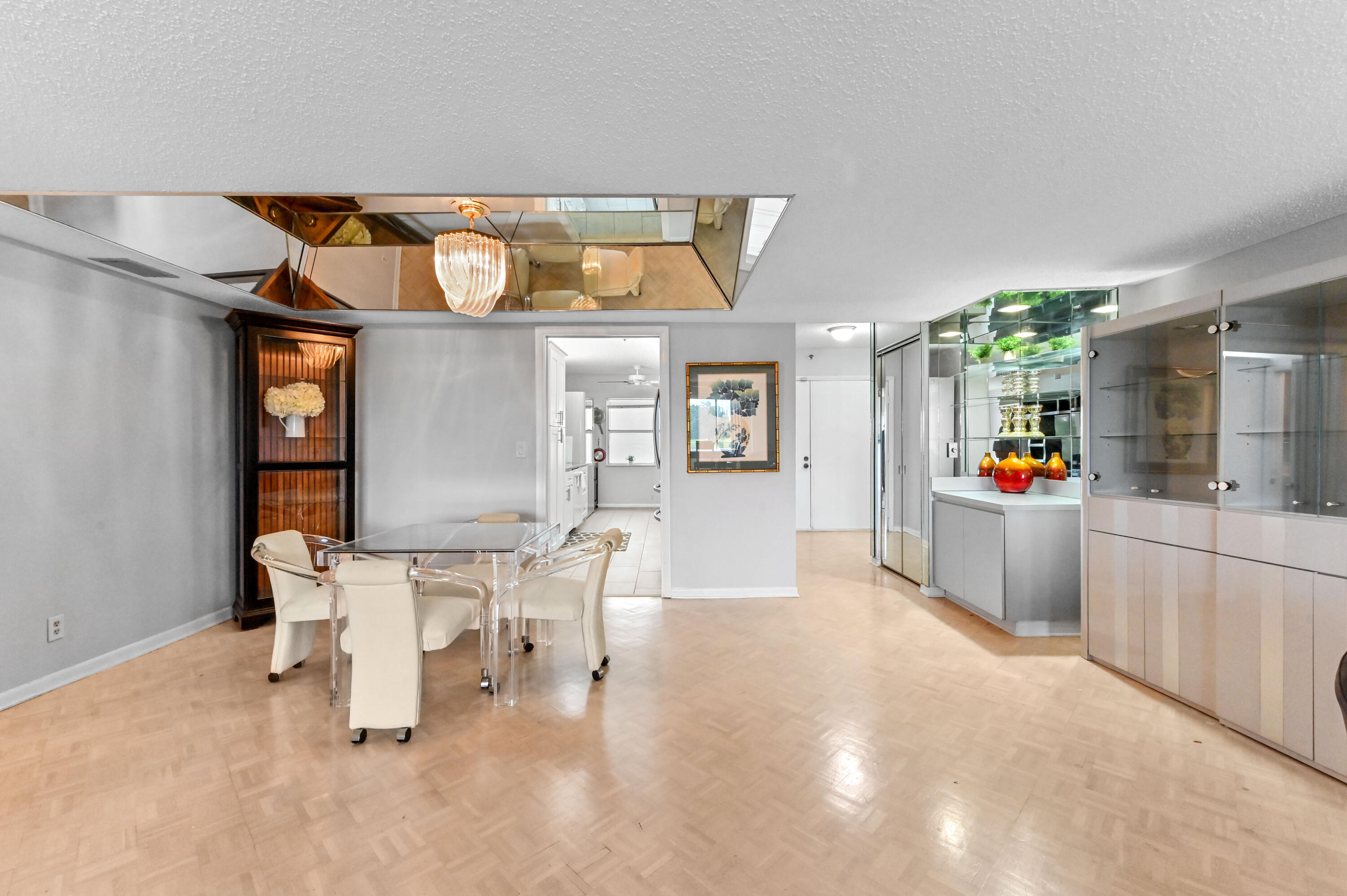 6768 10th Avenue North, Unit 316 Lake Worth, FL 33467 - Photo 8 of 38 a living room with furniture and a wooden floor