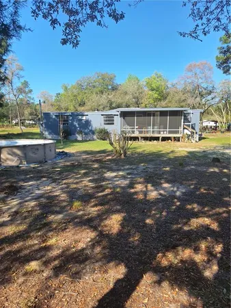a view of a large house with a yard
