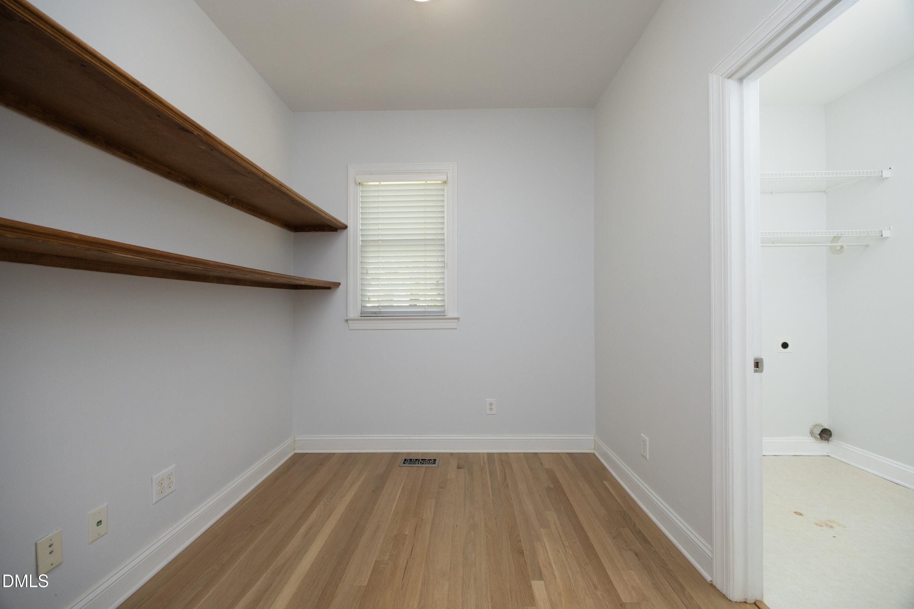 1427 Moosecreek Drive Raleigh, NC 27614 - Photo 34 of 51 a view of a small space with wooden floor and a window