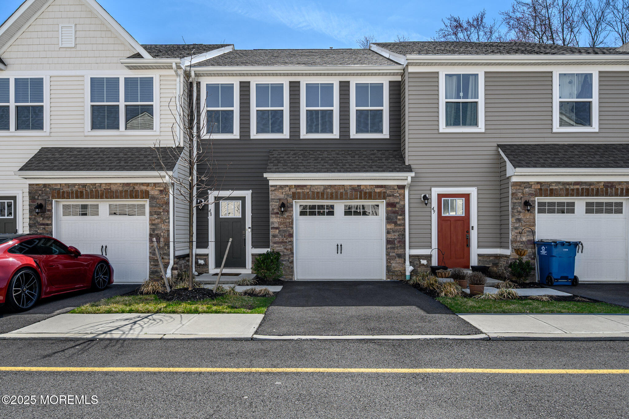 48 Athens Way Cliffwood, NJ 07721 - Photo 1 of 39 a front view of a house with a yard and a garage