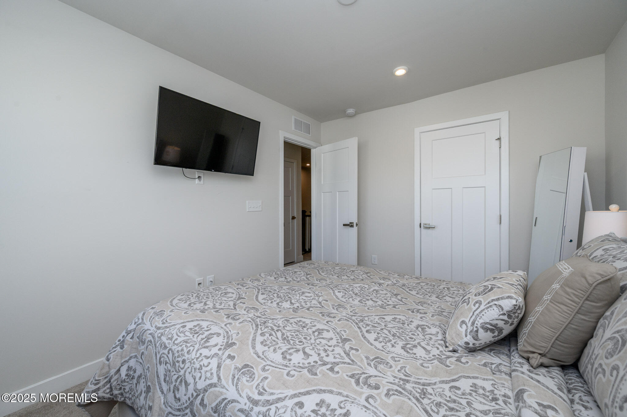 48 Athens Way Cliffwood, NJ 07721 - Photo 15 of 39 a bedroom with a bed and a television