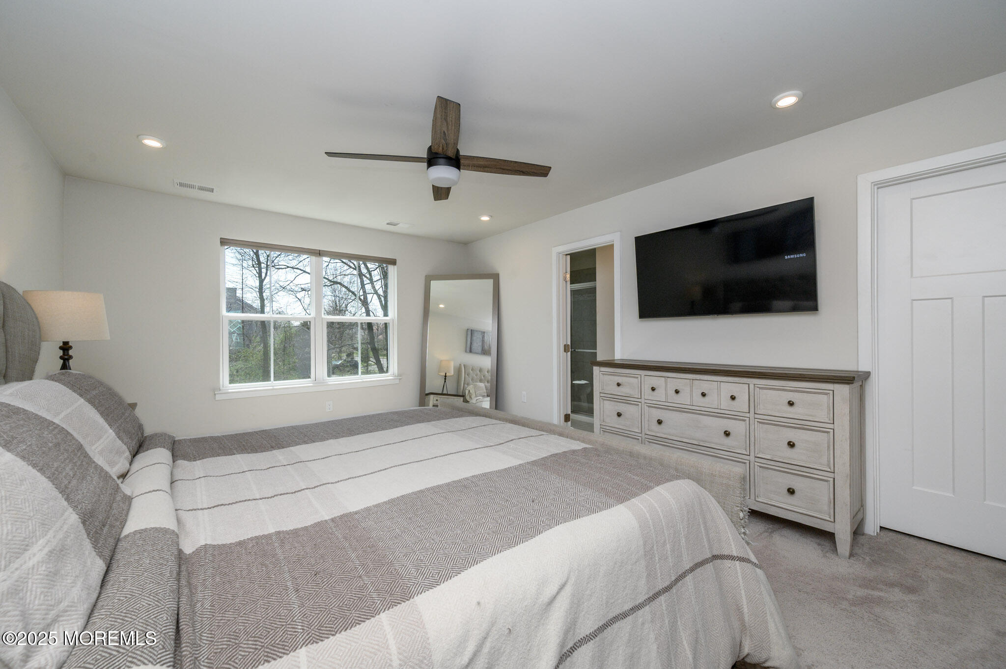48 Athens Way Cliffwood, NJ 07721 - Photo 22 of 39 a bedroom with a bed and a flat screen tv