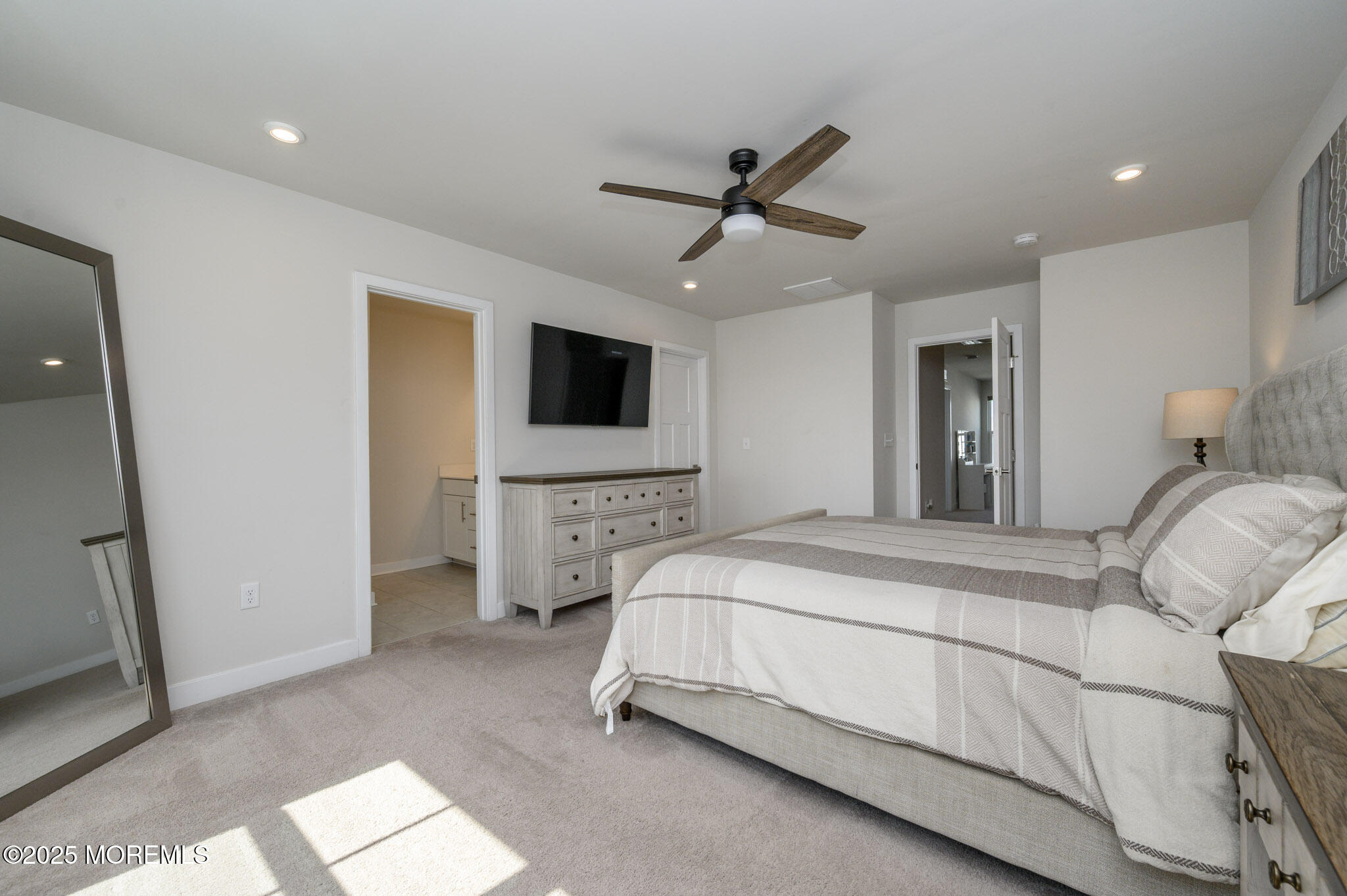 48 Athens Way Cliffwood, NJ 07721 - Photo 23 of 39 a spacious bedroom with a bed and a flat screen tv