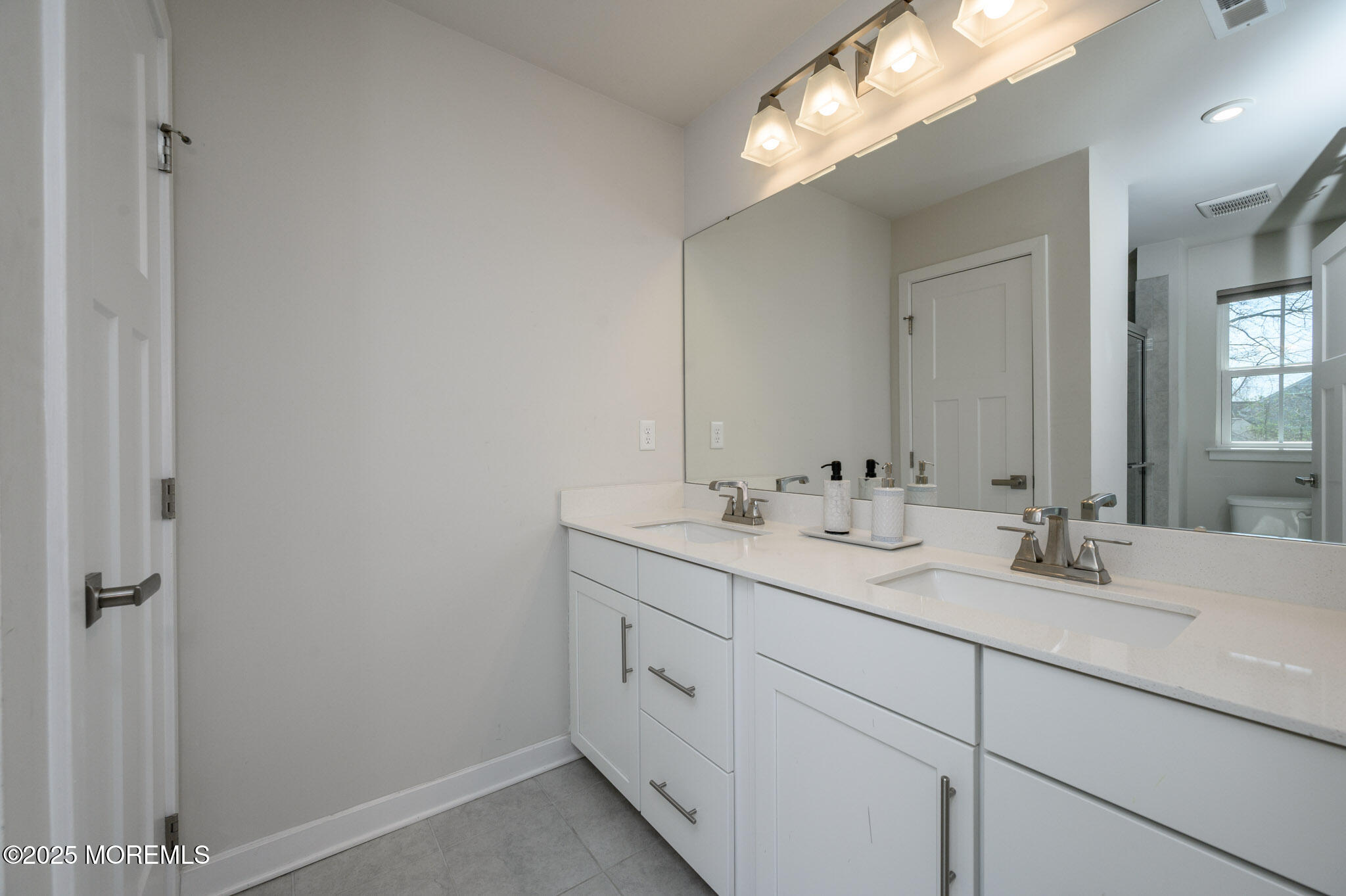 48 Athens Way Cliffwood, NJ 07721 - Photo 25 of 39 a bathroom with a double vanity sink and a mirror