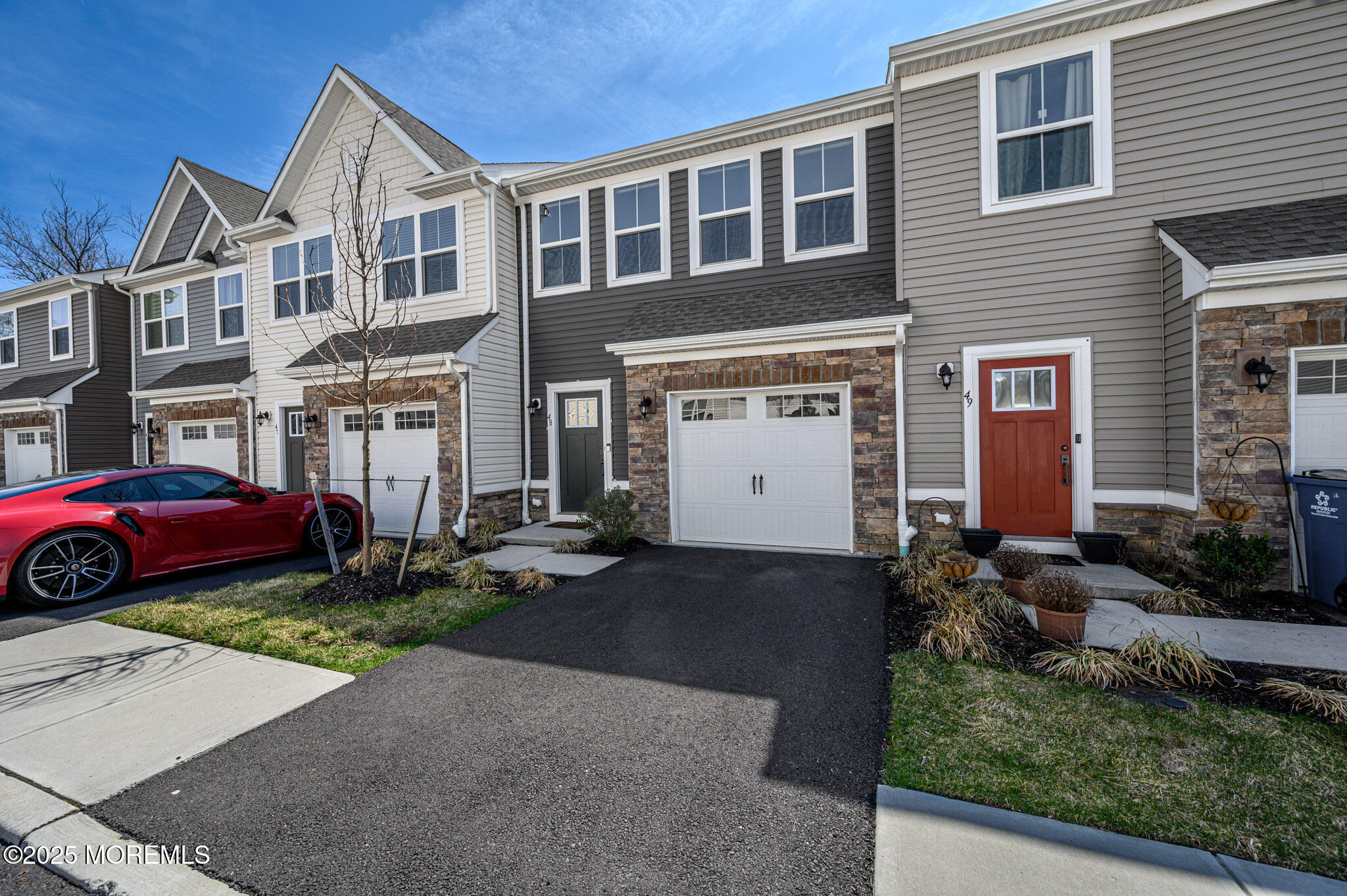48 Athens Way Cliffwood, NJ 07721 - Photo 30 of 39 a front view of a house with a yard and garage