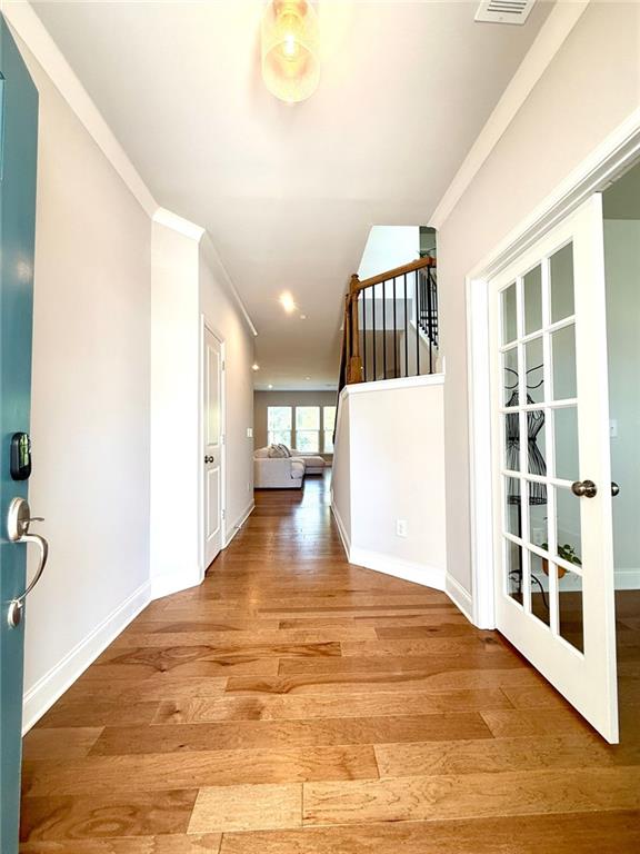26 Riverclub Road Acworth, GA 30101 - Photo 12 of 73 a view of an empty room with wooden floor and a window