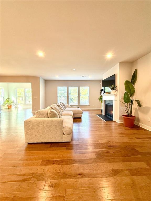 26 Riverclub Road Acworth, GA 30101 - Photo 16 of 73 a living room with furniture and a wooden floor