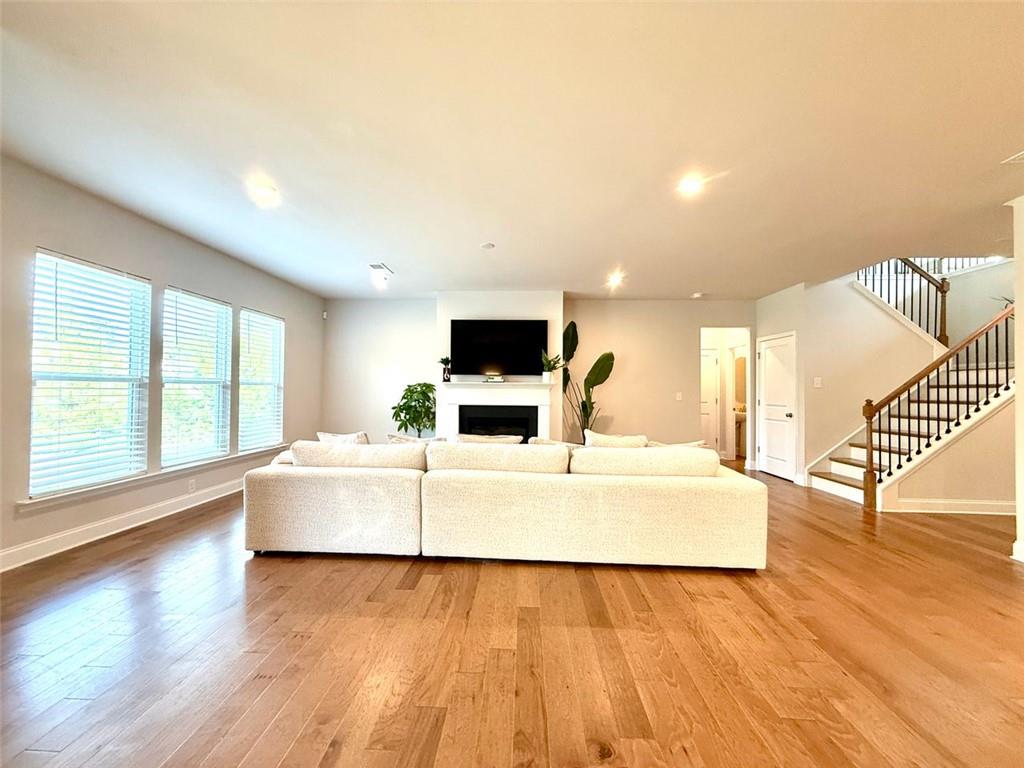 26 Riverclub Road Acworth, GA 30101 - Photo 19 of 73 a living room with a flat screen tv and a fireplace