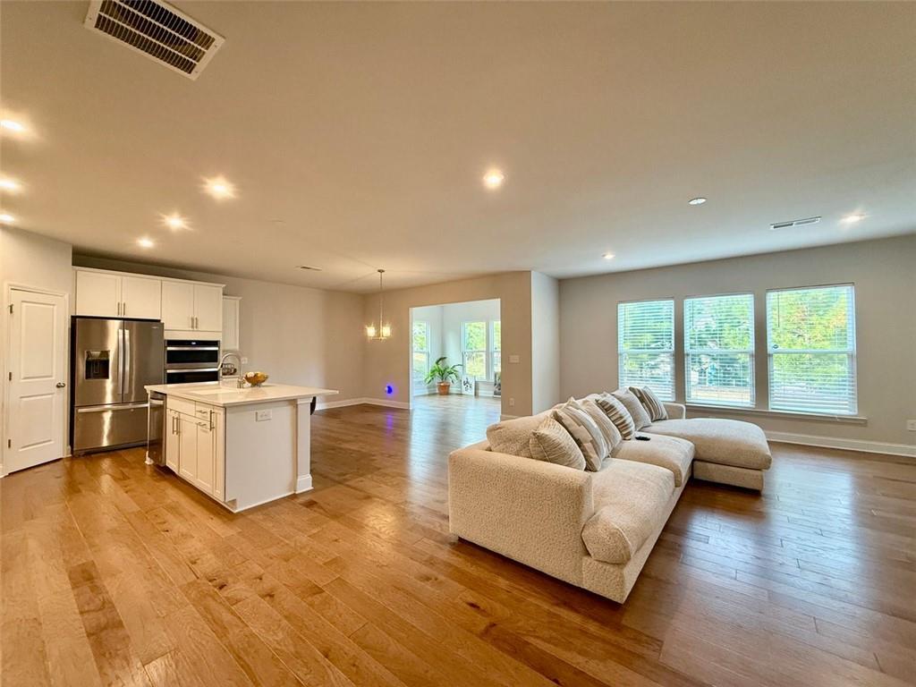 26 Riverclub Road Acworth, GA 30101 - Photo 23 of 73 a living room with furniture and a large window