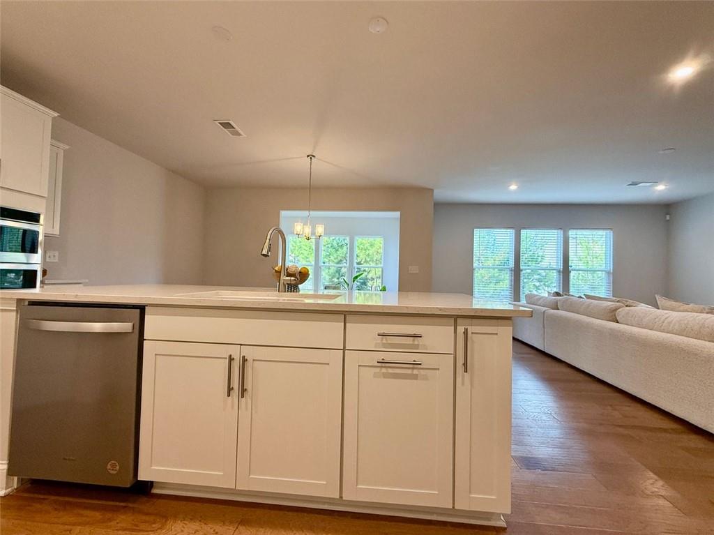 26 Riverclub Road Acworth, GA 30101 - Photo 26 of 73 a kitchen with granite countertop white cabinets and a large window