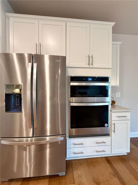 26 Riverclub Road Acworth, GA 30101 - Photo 29 of 73 a metallic refrigerator freezer sitting in a kitchen