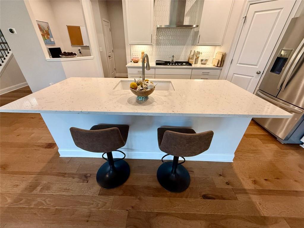 26 Riverclub Road Acworth, GA 30101 - Photo 34 of 73 a kitchen with a stove and a refrigerator